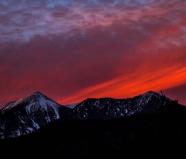 Capturing timeless emotions through natural light and fine art composition. Mountain sunset landscape in warm golden tones